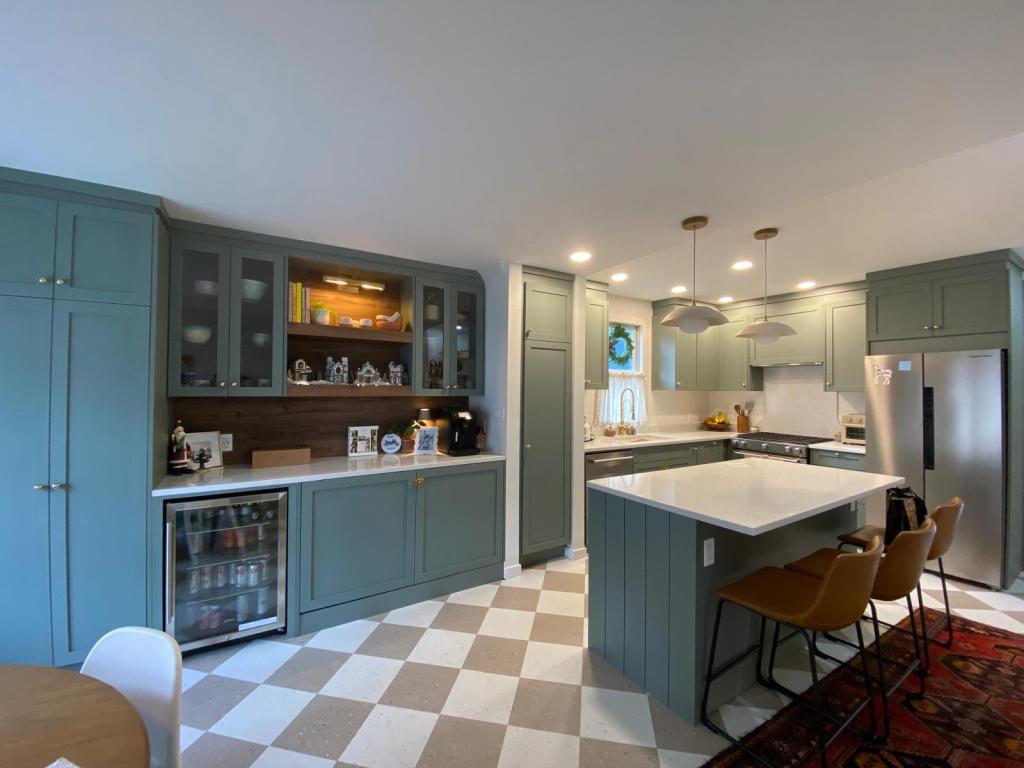Warm wooden kitchen cabinets close-up with natural oak grain and brass hardware